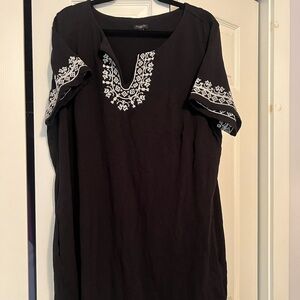 Black cotton dress with white embroidery.